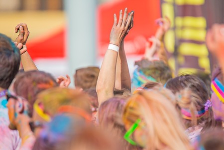 Close-up of marathon, people covered with colored powder.の写真素材