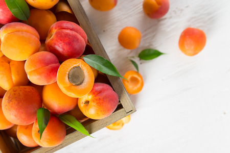 Fresh apricots on wooden table, close-up.の写真素材