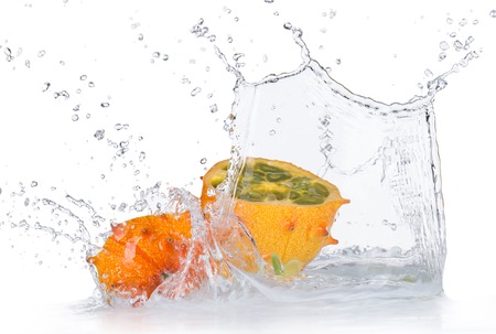 Fresh kiwano with water splashes isolated on white backgroundの写真素材