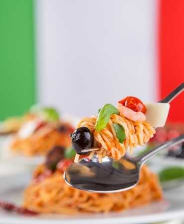 Italian pasta with tomato sauce, close-up.の写真素材