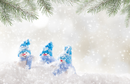 Christmas background with snowman and falling snow.の写真素材