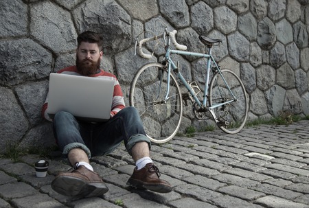 Handsome big moustache hipster man in the city.の写真素材