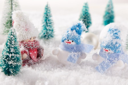 Christmas background with snowman and falling snow.の写真素材