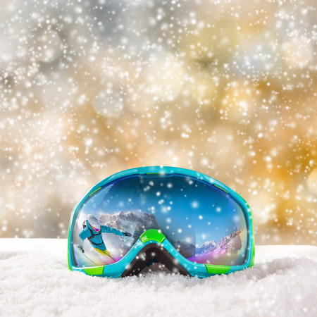 Colorful ski glasses on snow. Winter ski theme.の写真素材