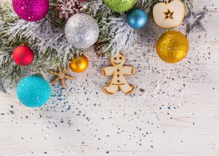 Abstract Christmas background with spruce branches on old wooden table.