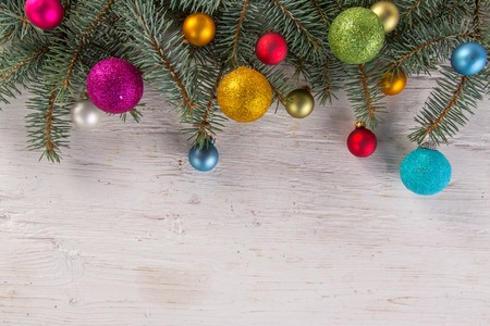 Abstract Christmas background with spruce branches on old wooden table.の写真素材