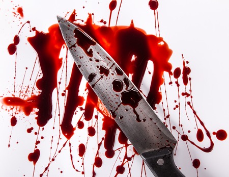 Murder concept - knife with blood on white background, close-up.の写真素材