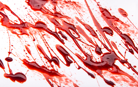 Splattered blood stains on white background, close-up.の写真素材
