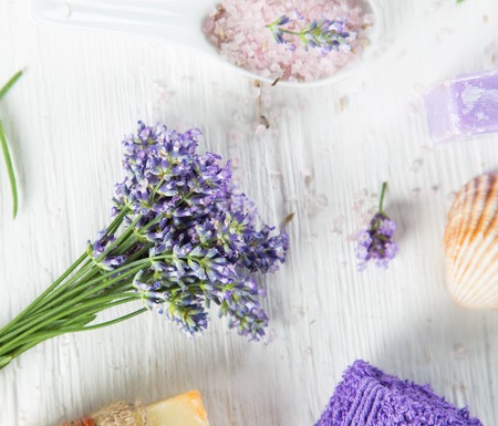 Wellness treatments with lavender flowers on wooden table. Spa still-life.の写真素材