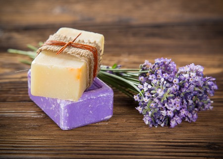 Wellness treatments with lavender flowers on wooden table. Spa still-life.の写真素材