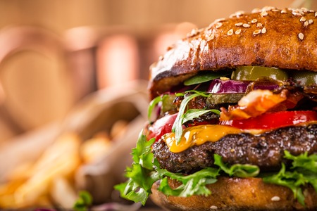 Close-up of home made tasty burgers on wooden table.の写真素材