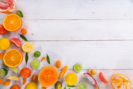 Citrus fresh fruits on a wooden table, close-up.の写真素材