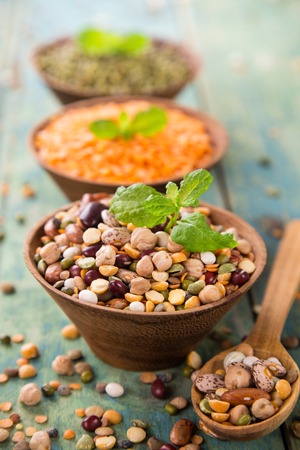 Raw legume on old rustic wooden table, close-up.の写真素材