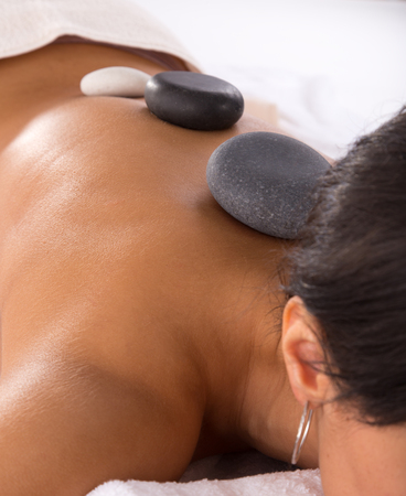 Young beautiful brunette woman getting spa procedures.の写真素材