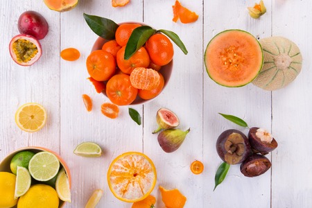 Citrus fresh fruits on a wooden table, close-up.の写真素材