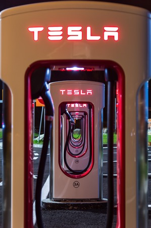 BRENNER, AUSTRIA - MAY 11, 2016: Tesla supercharger machine at Supercharger Station at night.のeditorial素材