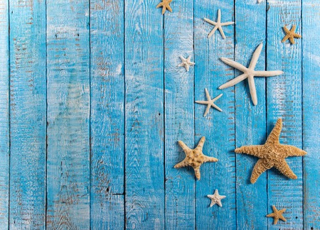 Summer fashion item on old blue wooden table.の写真素材