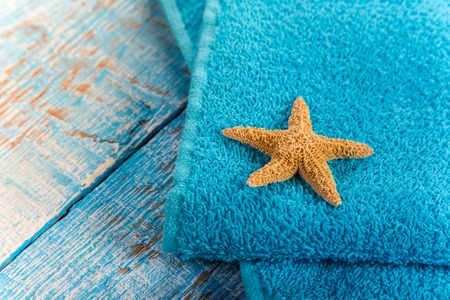 Summer fashion item on old blue wooden table.の写真素材