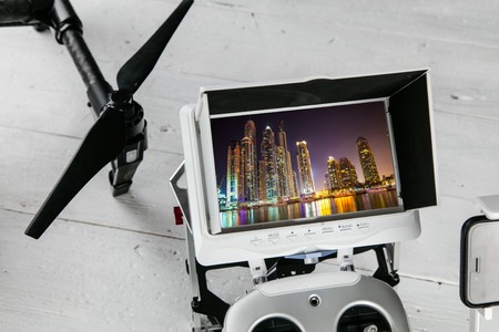 Drone aerial photography concept - Radio control transmitter with monitor, close-up.