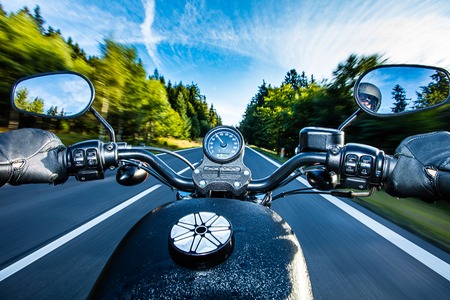 The view over the handlebars of high power cruiser motorcycle.の写真素材