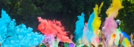 Close-up of marathon, people covered with colored powder.の写真素材