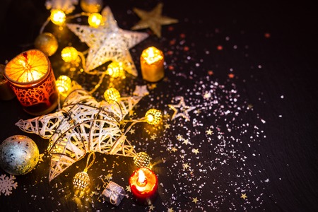 Shiny Christmas decorations against a black background