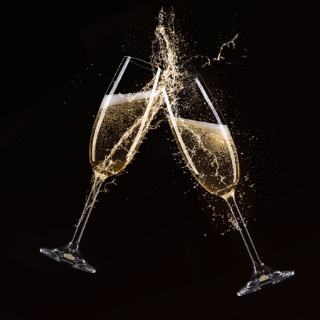 Glasses of champagne with splash, celebration theme.の写真素材