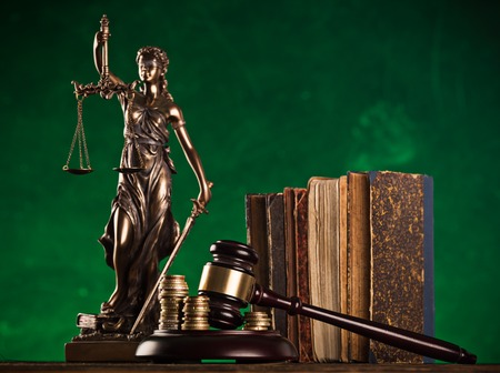 brown gavel with statue of justice.の写真素材