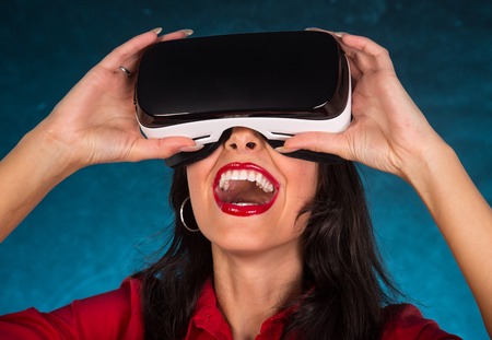 Happy woman with glasses of virtual reality.