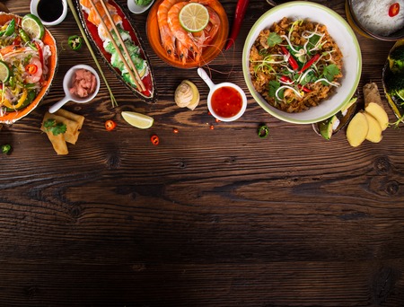 Various of asian meals on rustic background , top view , place for text.
