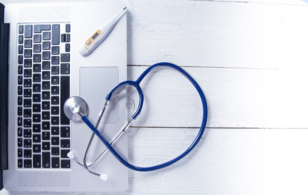 Stethoscope with a modern laptop.の写真素材