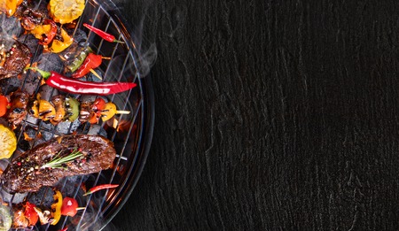 Barbecue grill with beef steaks, close-up.の写真素材