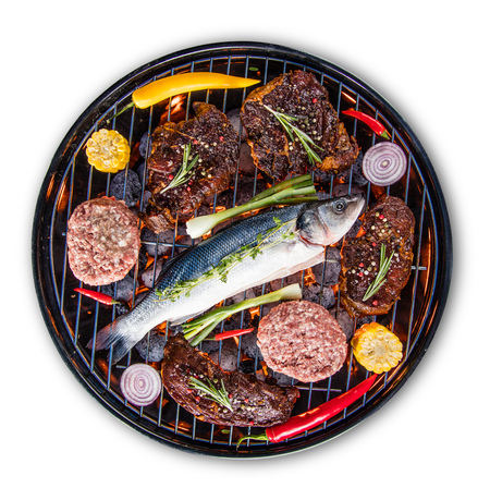 Barbecue grill with beef steaks, close-up.