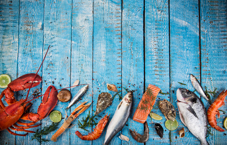 Fresh tasty seafood served on old wooden table.の写真素材