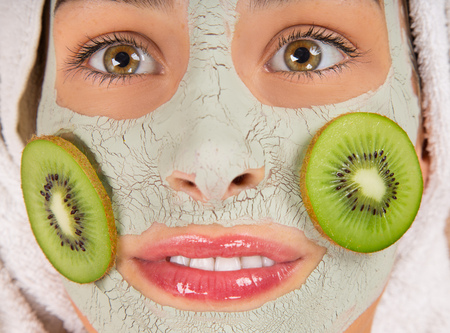 Young healthy woman in spa making treatments and face mask.の写真素材