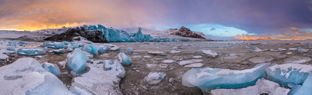 Famous Fjallsarlon glacier and lagoon with icebergs swimming on frozen water, southern Iceland, Europe.の写真素材