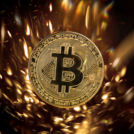 Bitcoin gold coin with defocused abstract background. Virtual cryptocurrency concept.