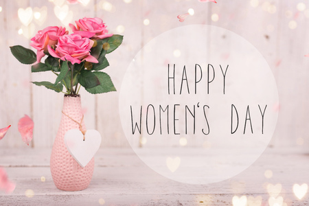 Flowers composition for Women's Day. Pink flowers on old white wooden background. Still-life.の写真素材
