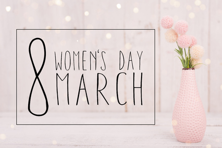 Flowers composition for Womens Day. Pink flowers on old white wooden background.の写真素材