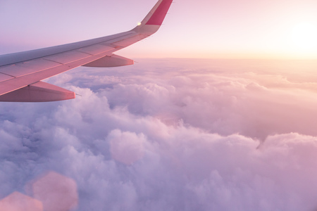 Sunset sky with beautiful clouds from the airplane window