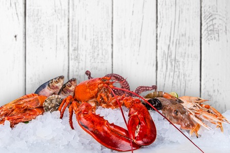 Fresh tasty seafood served on old wooden table.の写真素材
