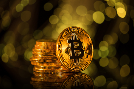 Bitcoin gold coin with defocused abstract background.の写真素材