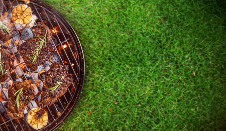 Barbecue grill with beef steaks, close-up.の写真素材