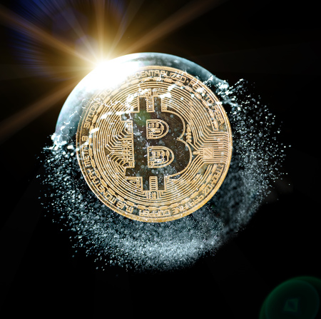 Bitcoin coin in a soap bubble. Concept of instability of the crypto currency over black background.の写真素材