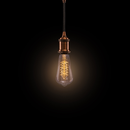 Vintage light bulb on dark background.の写真素材