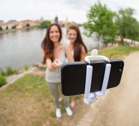 Two beautiful girls taking a selfieの写真素材
