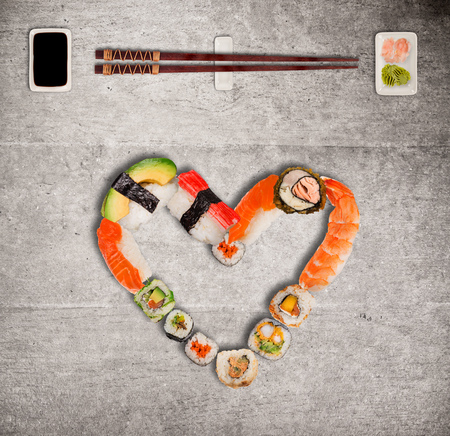 Traditional japanese sushi pieces making inscription and heart symbol.の写真素材