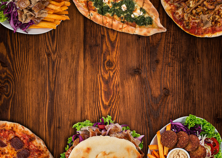 Top down view on traditional turkish meals on vintage wooden table. Close-up.の写真素材