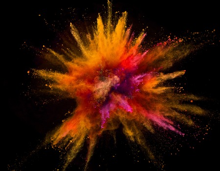 Colored powder explosion isolated on black background. Freeze motion.