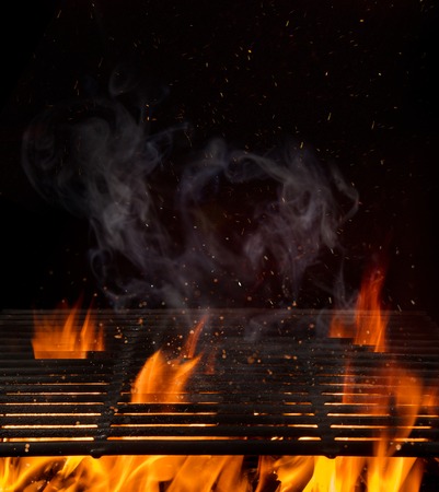 Empty flaming charcoal grill with open fire.の写真素材